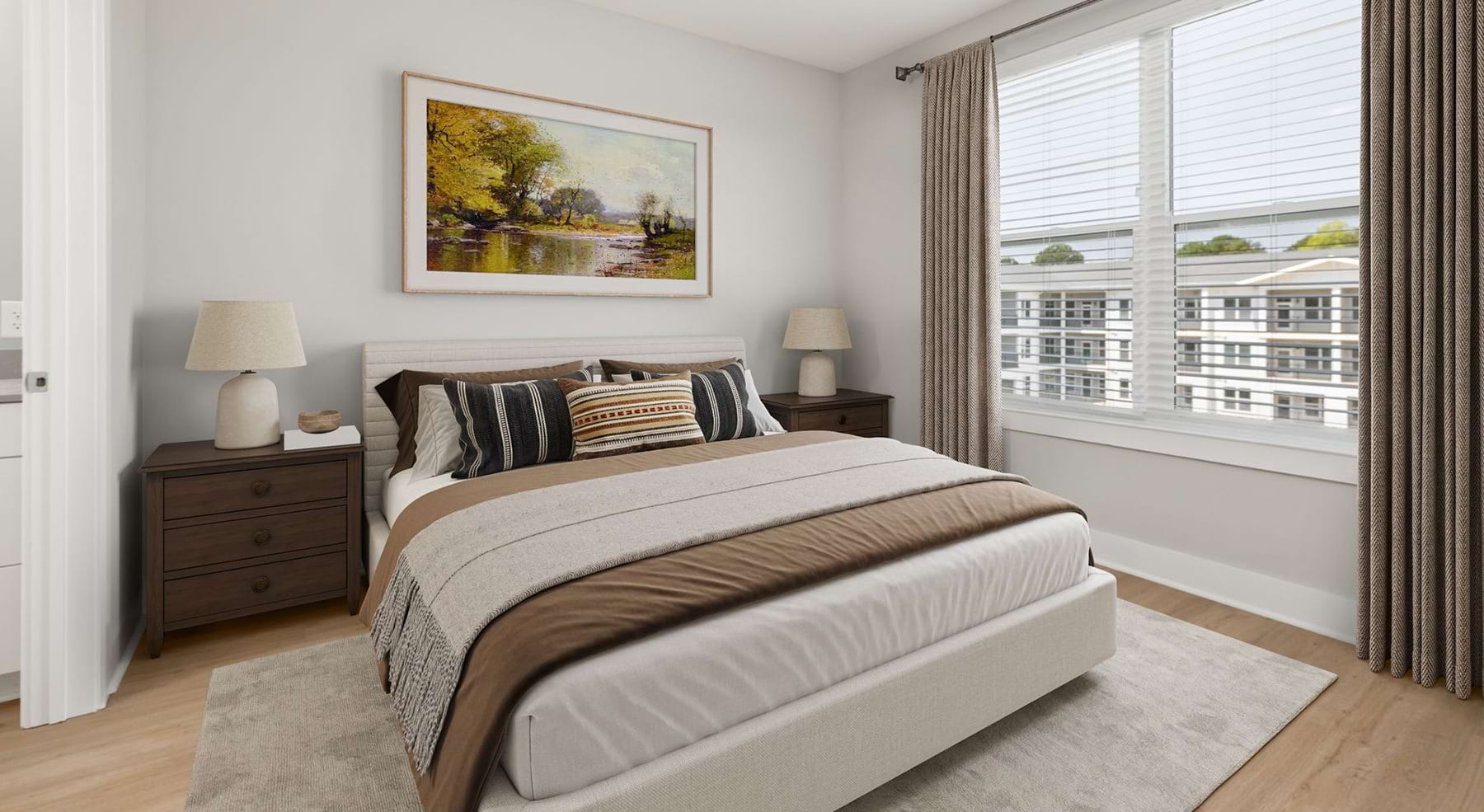 bedroom with bed and end table with a lamp