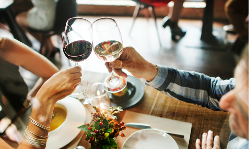 people with drinks in celebration