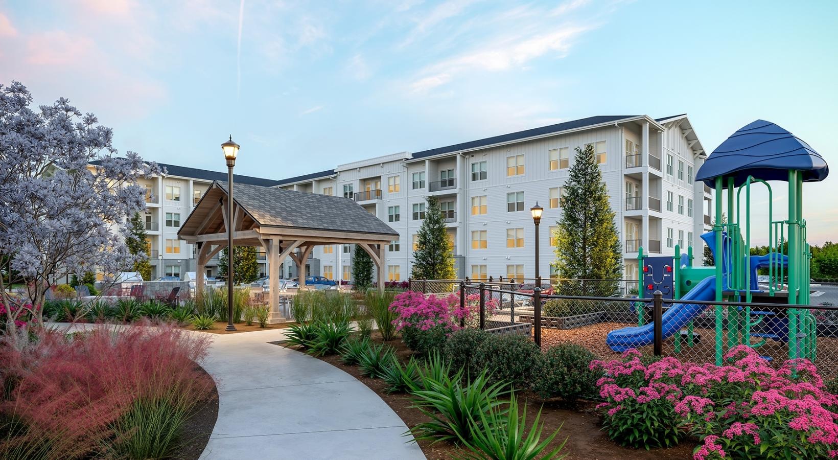 a building with a garden in front